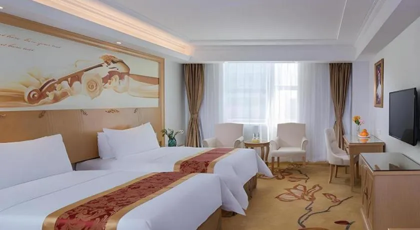 Bed in Vienna Hotel Shenzhen Longgang Baifucheng