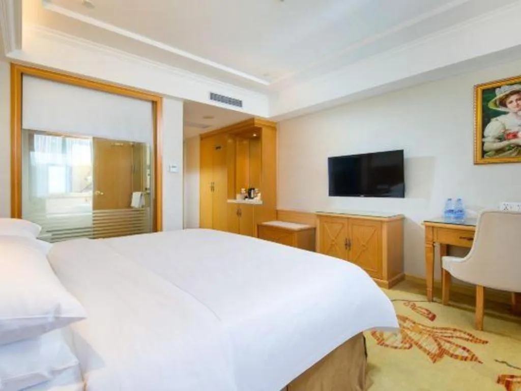 Bed in Vienna Hotel Shenzhen Longgang Baifucheng