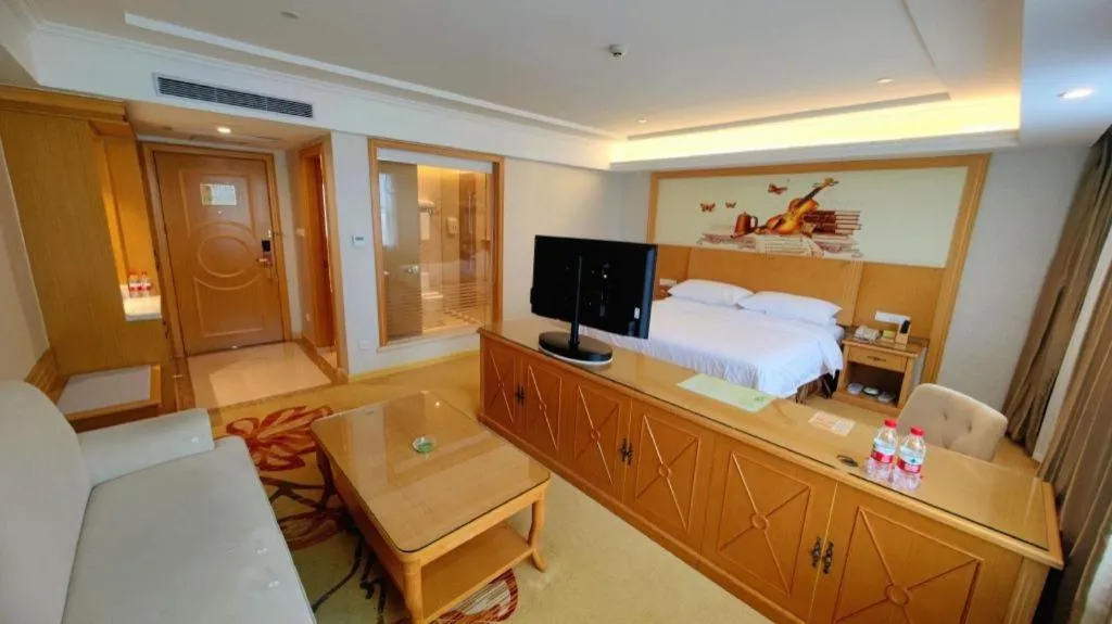 Bed in Vienna Hotel Shenzhen Longgang Baifucheng