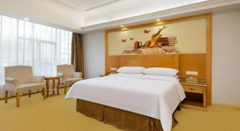 Bed in Vienna Hotel Shenzhen Longgang Baifucheng
