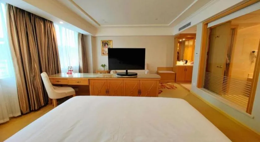 Bed in Vienna Hotel Shenzhen Longgang Baifucheng