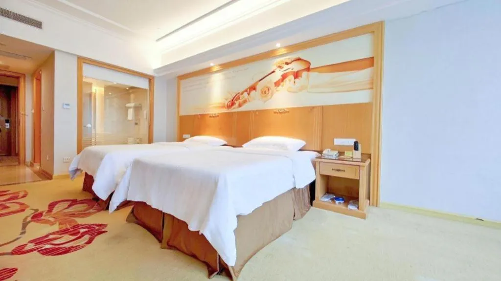 Bed in Vienna Hotel Shenzhen Longgang Baifucheng