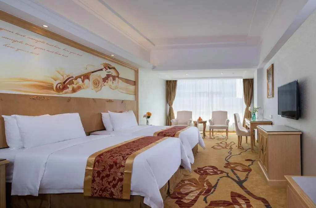 Bed in Vienna Hotel Shenzhen Longgang Baifucheng