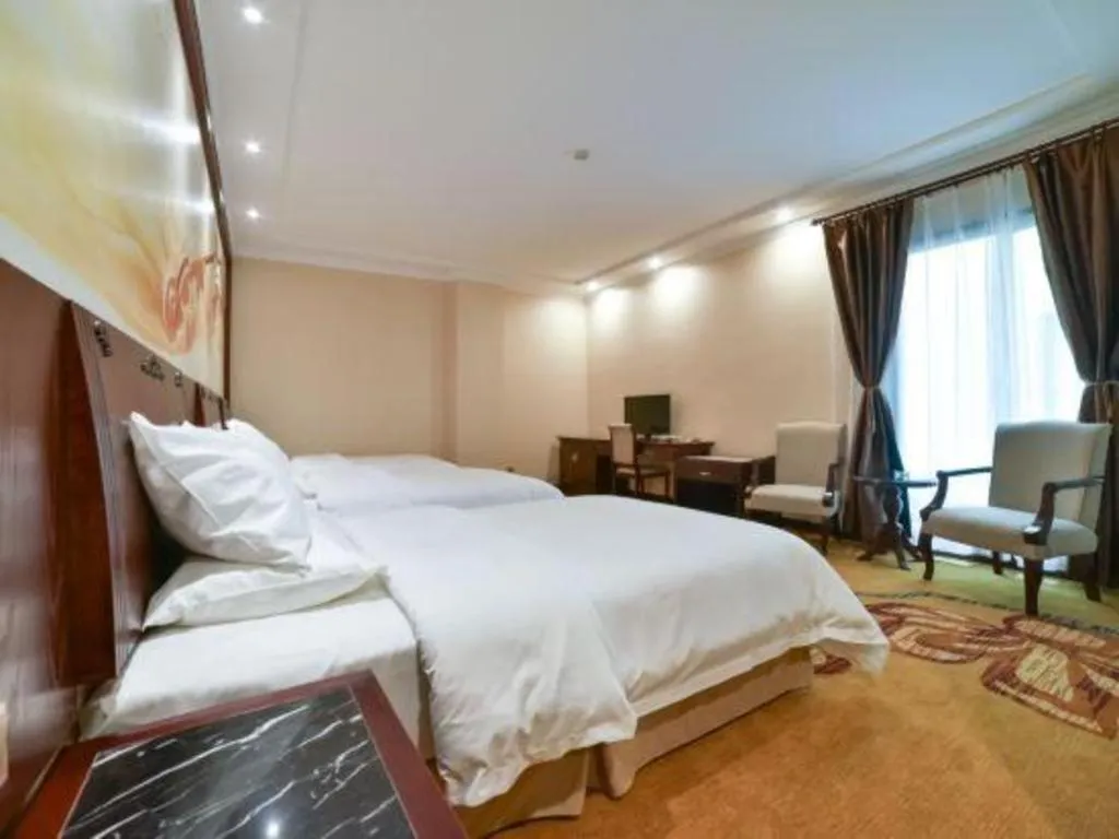 Bed in Vienna Classic Hotel Zhangzhou Longchi Center