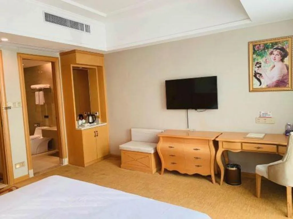 Bed in Vienna Hotel Guangdong Huizhou Lilin North Railway Station