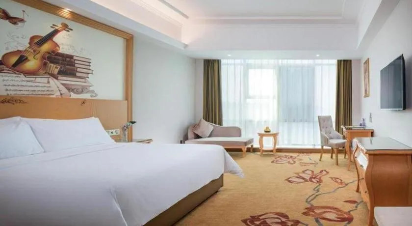 Bed in Vienna Hotel Guangdong Huizhou Lilin North Railway Station
