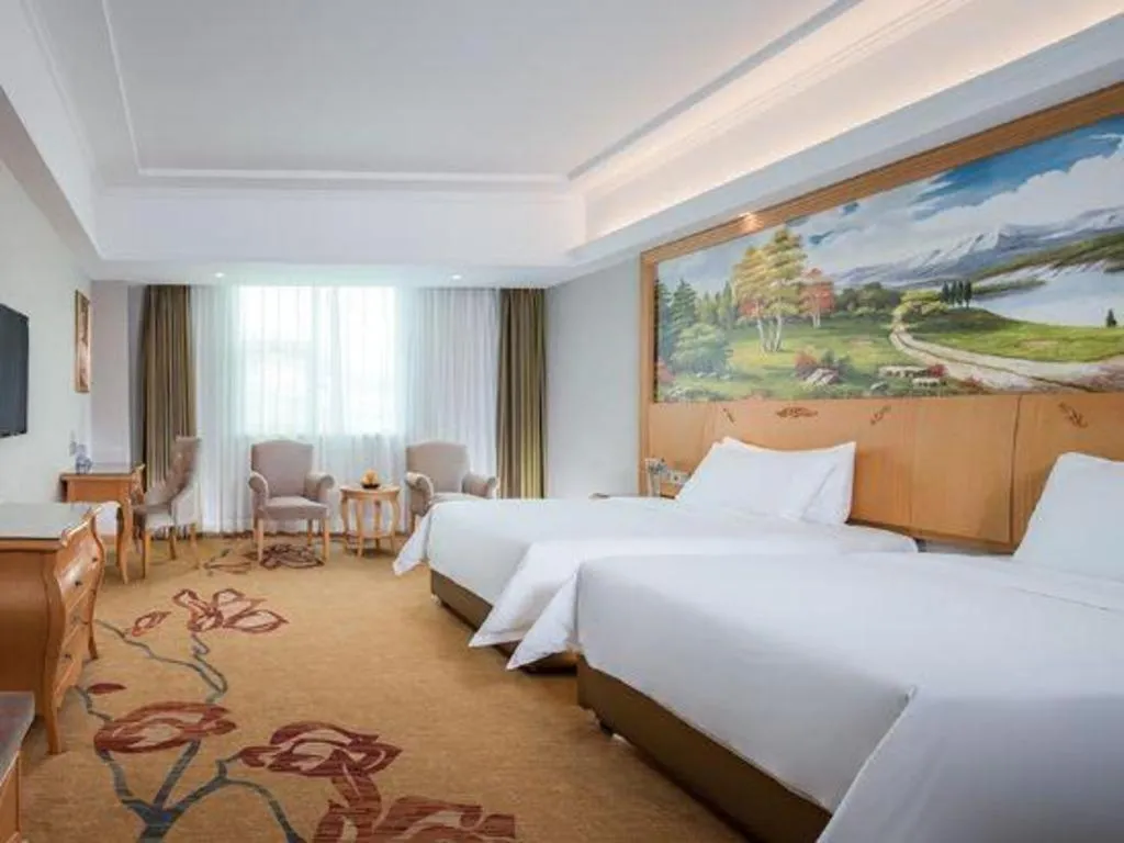 Bed in Vienna Hotel Guangdong Huizhou Lilin North Railway Station