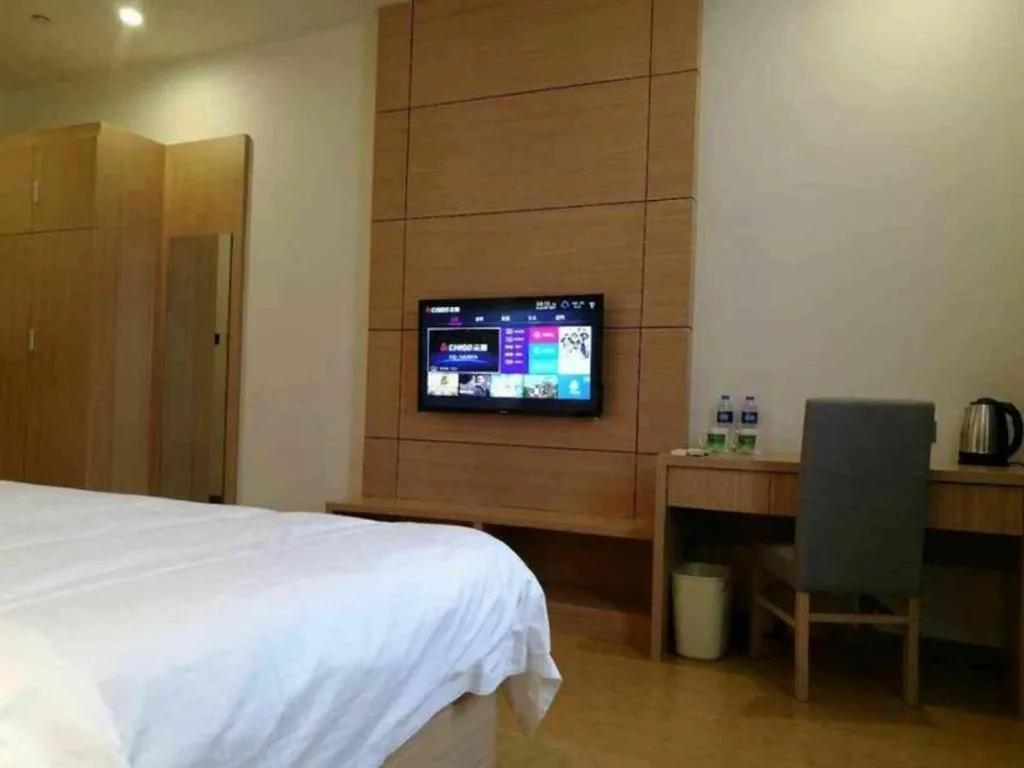 Bed in GreenTree Inn Yancheng Dongtai Fuan Town Express Hotel