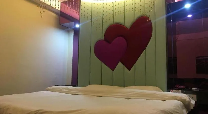 Bed in Shell Hotel Shanghai Baoshan Meilanhu Luosheng Road