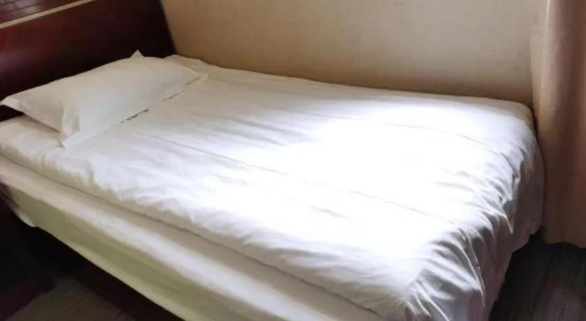 Bed in Shell Hotel Shanghai Baoshan Meilanhu Luosheng Road