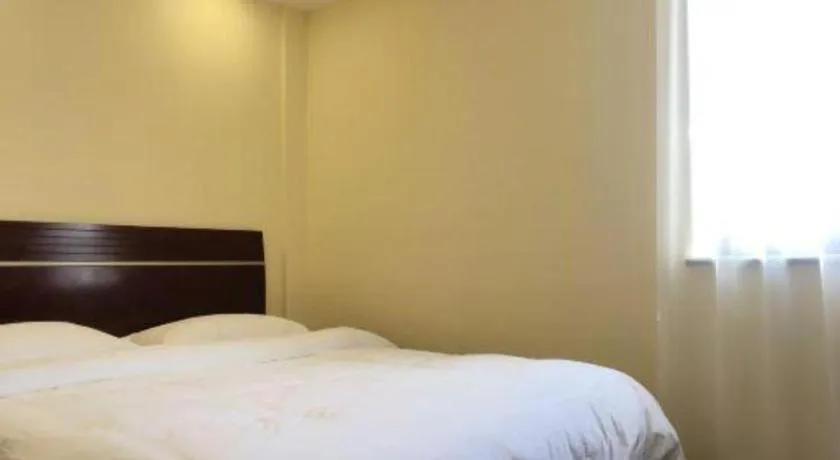 Bed in Shell Hotel Shanghai Baoshan Meilanhu Luosheng Road