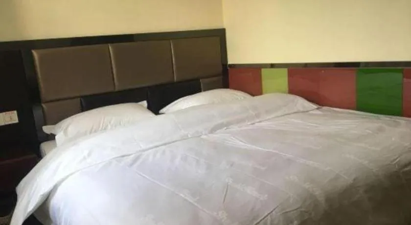 Bed in Shell Hotel Shanghai Baoshan Meilanhu Luosheng Road