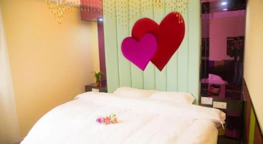 Bed in Shell Hotel Shanghai Baoshan Meilanhu Luosheng Road