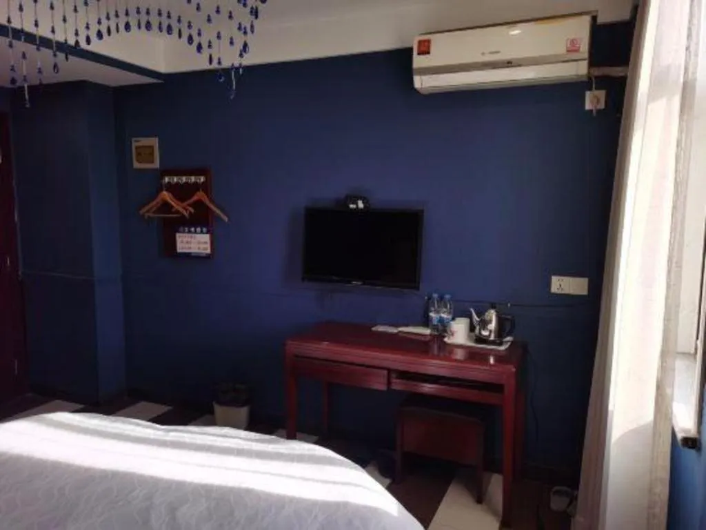 Bed in Shell Hotel Shanghai Baoshan Meilanhu Luosheng Road