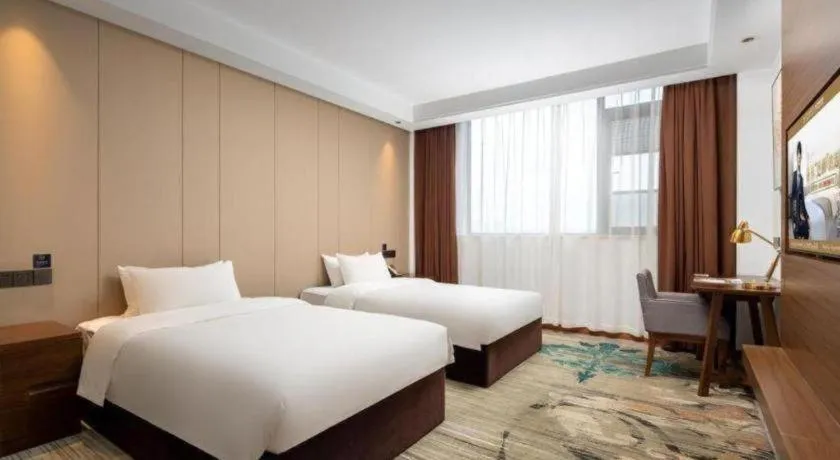 Bed in GME Taizhou Jingjiang City Bus Station Hotel