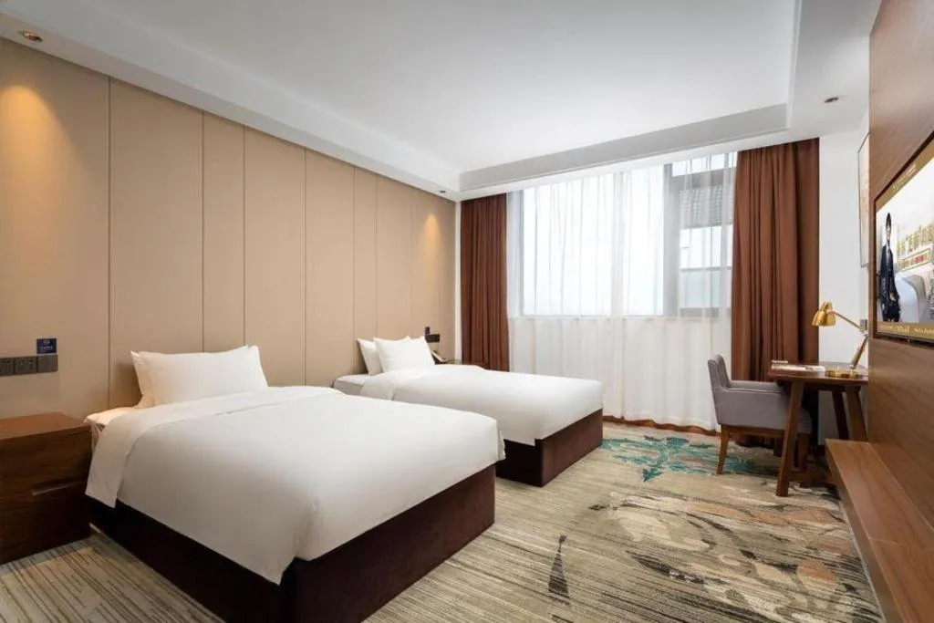 Bed in GME Taizhou Jingjiang City Bus Station Hotel