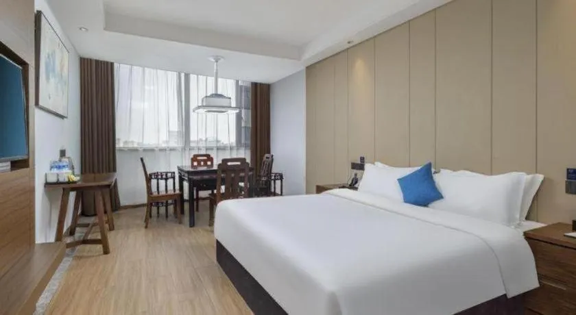 Bed in GME Taizhou Jingjiang City Bus Station Hotel