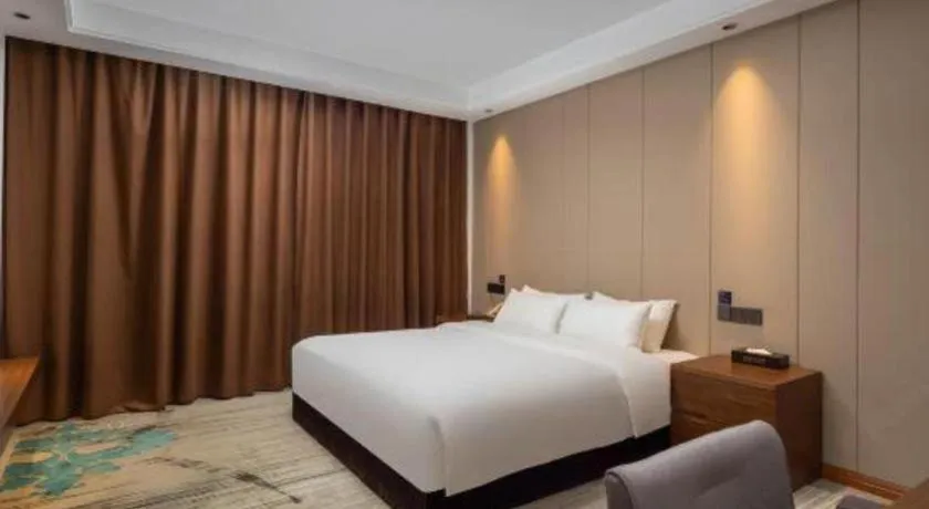 Bed in GME Taizhou Jingjiang City Bus Station Hotel