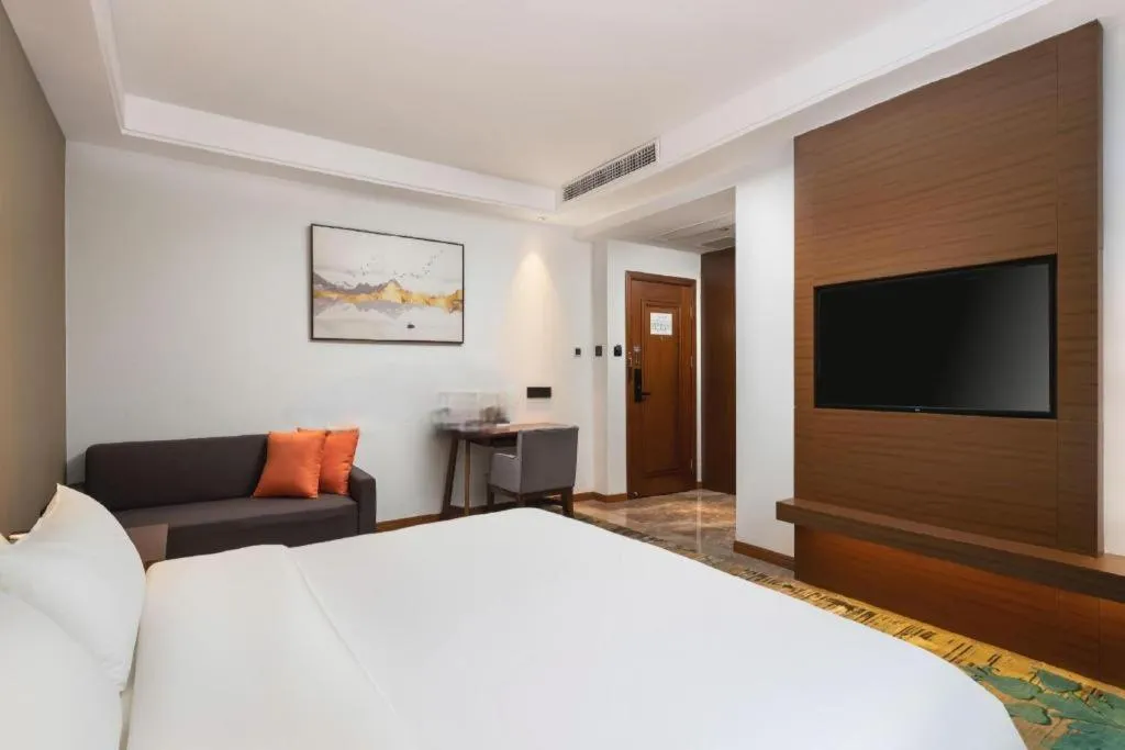 Bed in GME Taizhou Jingjiang City Bus Station Hotel