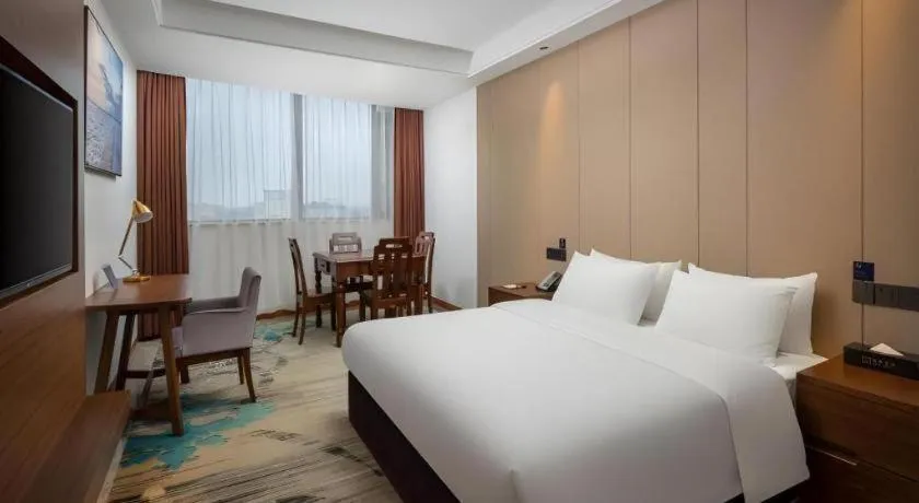 Bed in GME Taizhou Jingjiang City Bus Station Hotel