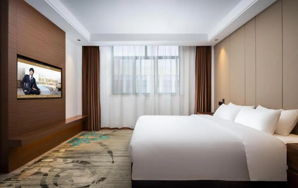 Bed in GME Taizhou Jingjiang City Bus Station Hotel