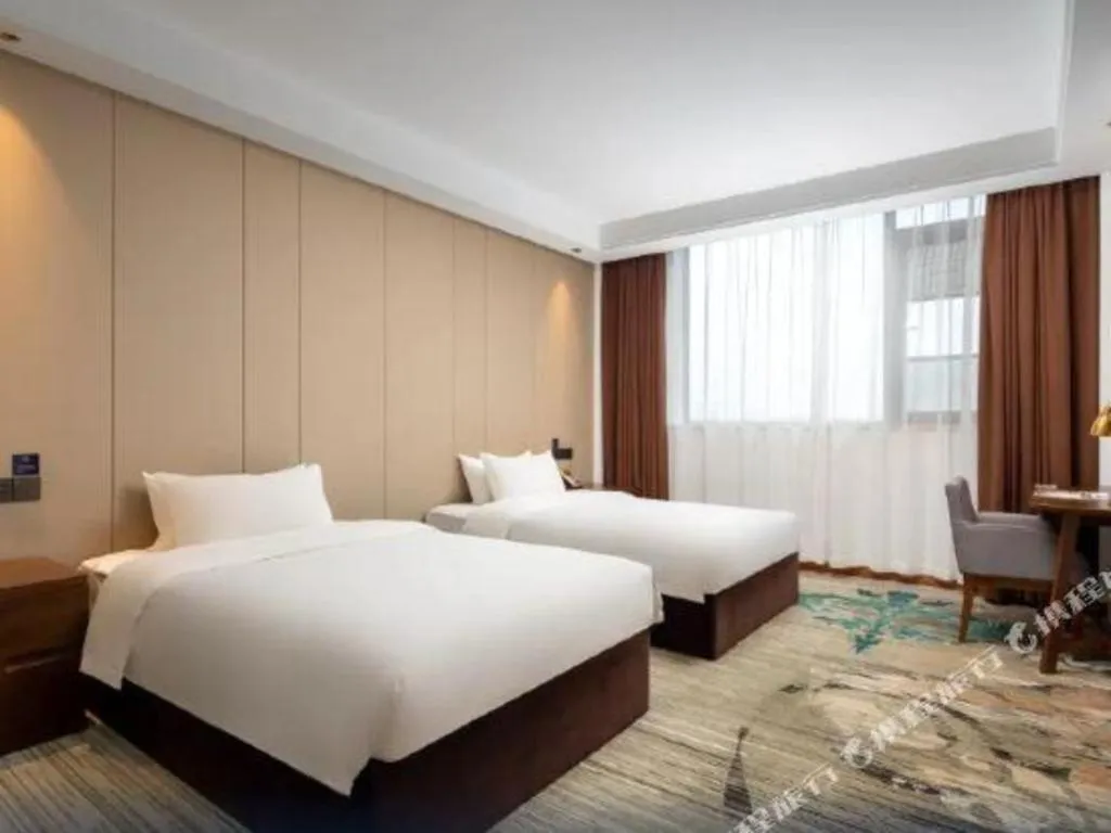 Bed in GME Taizhou Jingjiang City Bus Station Hotel