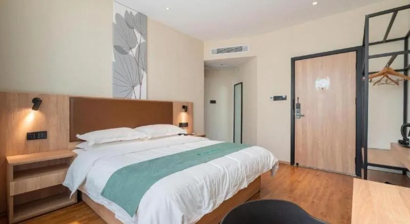 Bed in GreenTree Inn Wuxi Quanshan Center
