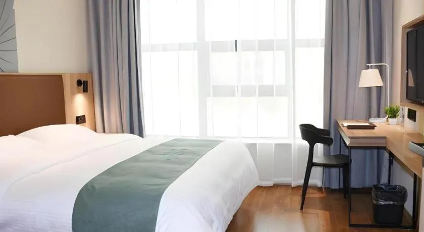 Bed in GreenTree Inn Wuxi Quanshan Center