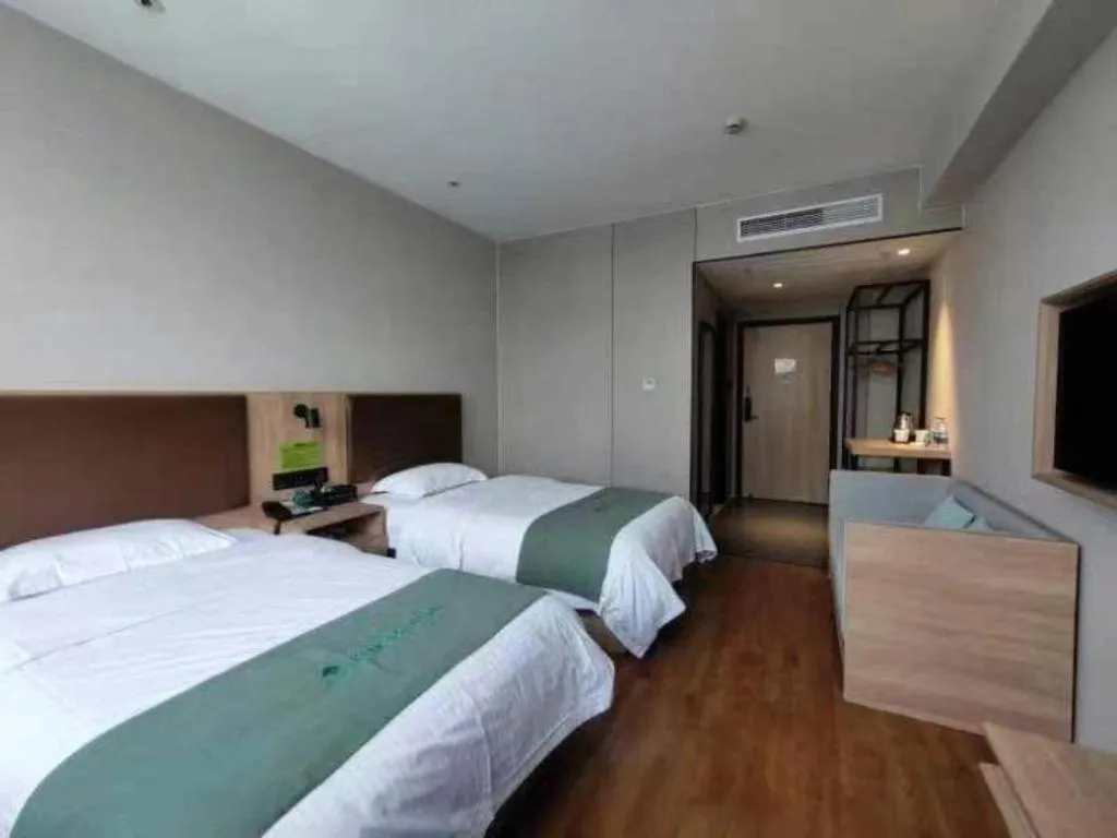 Bed in GreenTree Inn Wuxi Quanshan Center