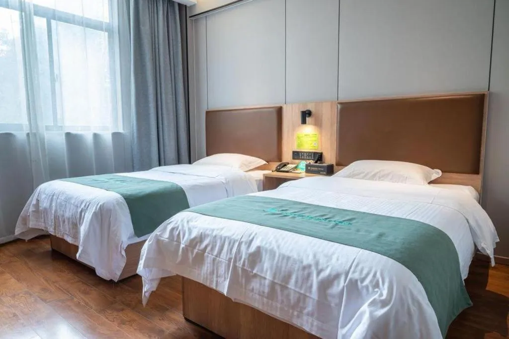 Bed in GreenTree Inn Wuxi Quanshan Center