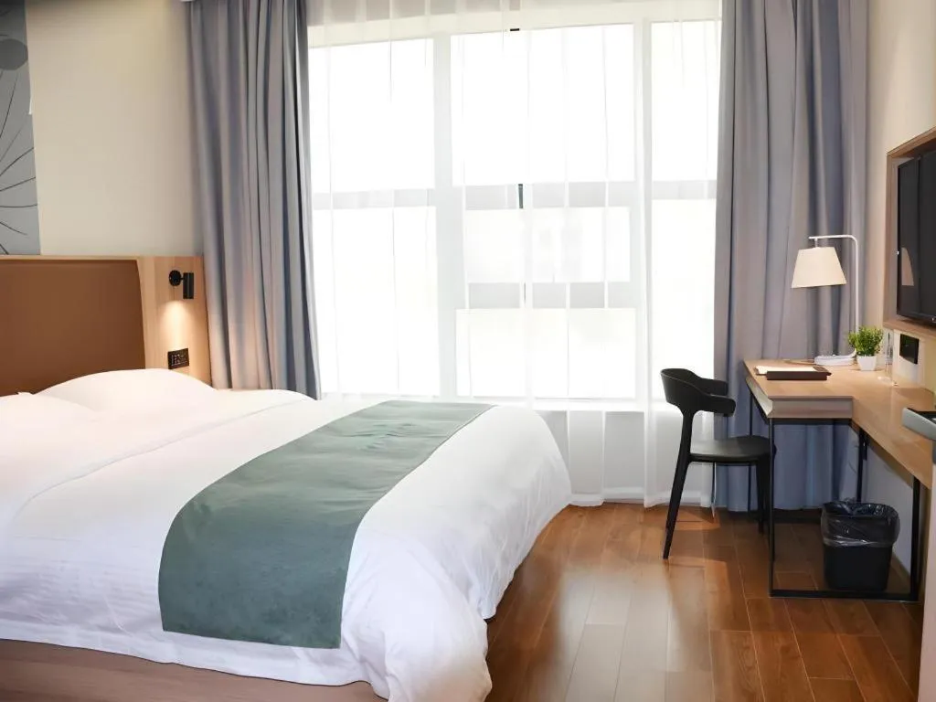 Bed in GreenTree Inn Wuxi Quanshan Center