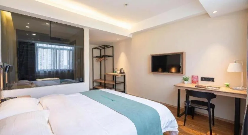 Bed in GreenTree Inn Wuxi Quanshan Center
