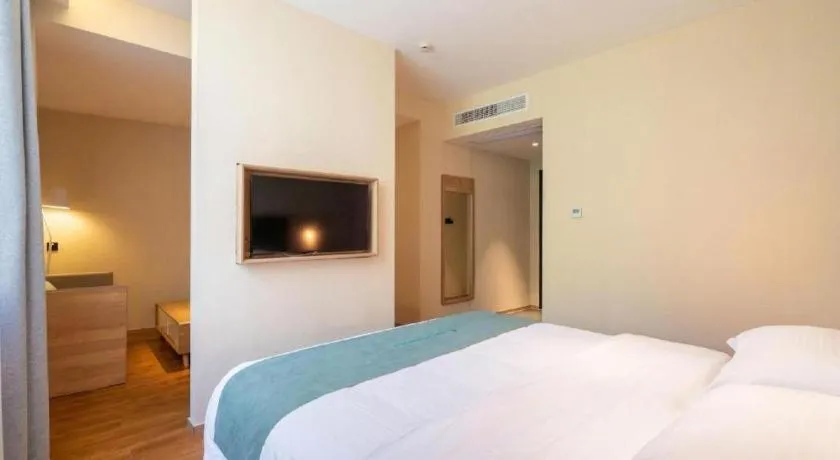 Bed in GreenTree Inn Wuxi Quanshan Center