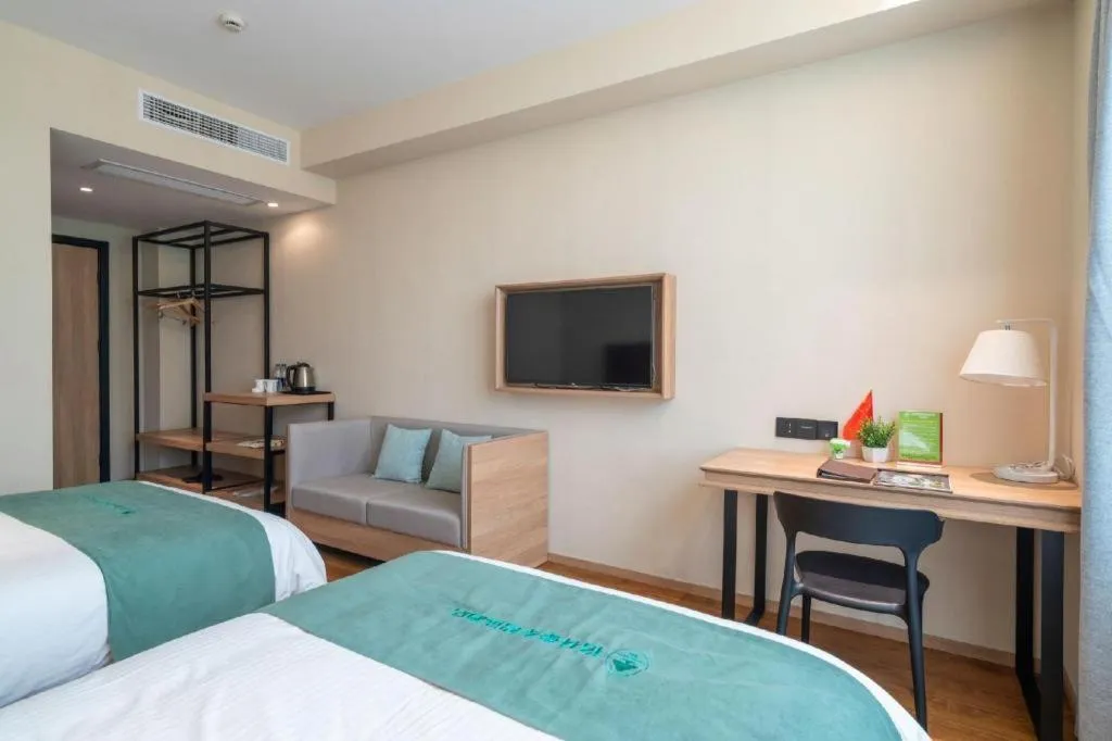Bed in GreenTree Inn Wuxi Quanshan Center
