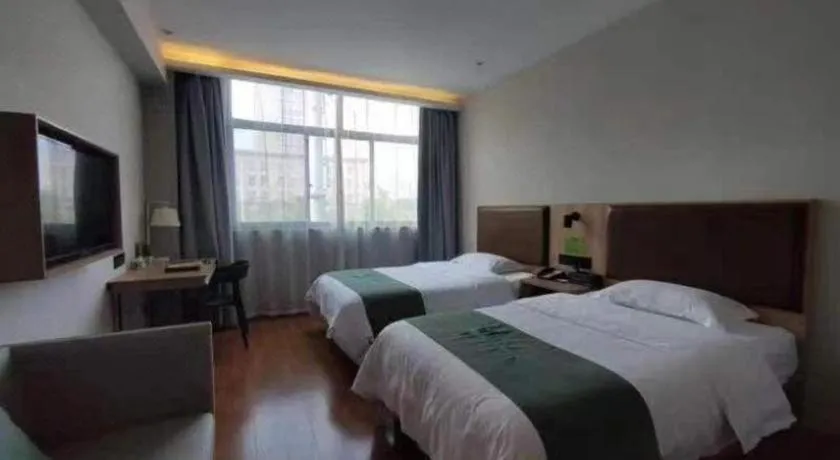 Bed in GreenTree Inn Wuxi Quanshan Center