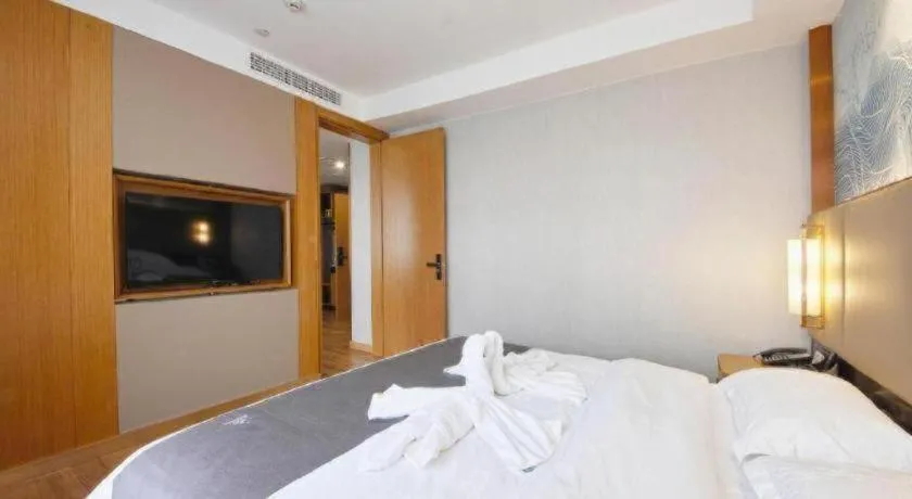 Bed in GreenTree Eastern Hotel Huai'an Bus Station Zhou Enlai Memorial