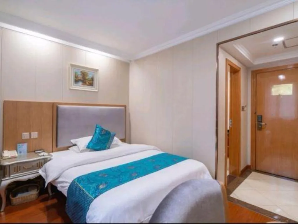 Bed in GreenTree Inn Wuxi Xinwu District Meicun Town Taibo Avenue