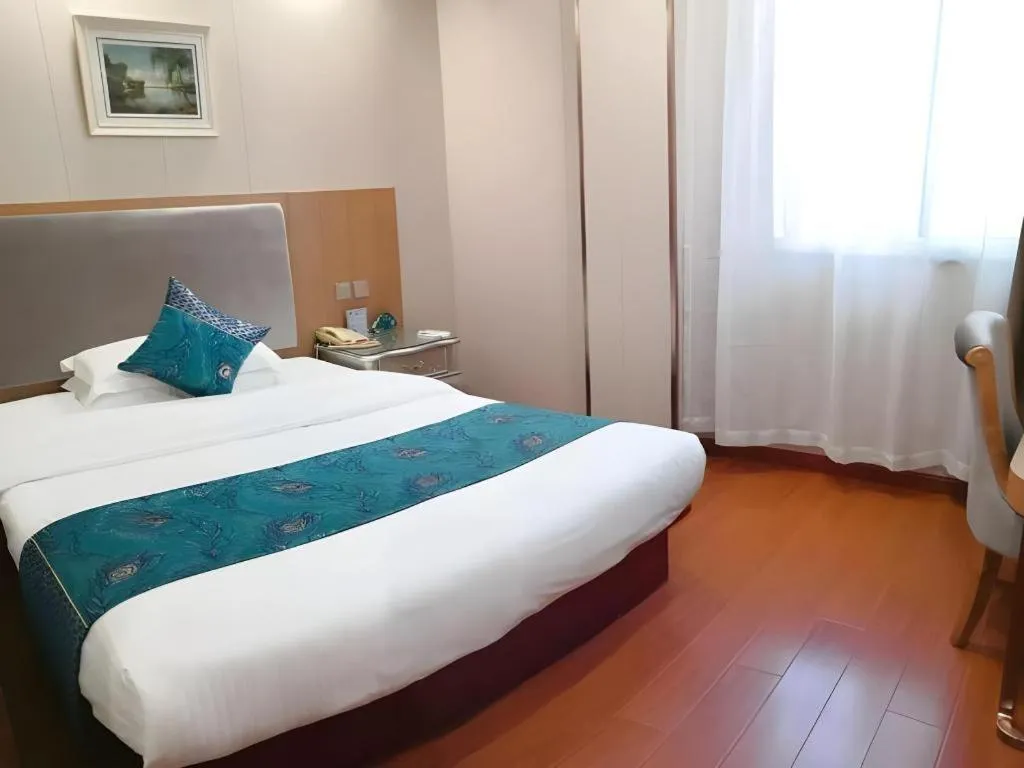Bed in GreenTree Inn Wuxi Xinwu District Meicun Town Taibo Avenue