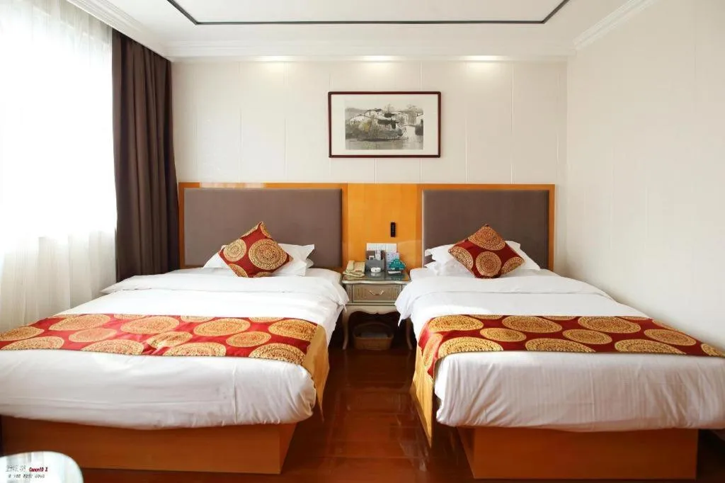 Bed in GreenTree Inn Wuxi Xinwu District Meicun Town Taibo Avenue