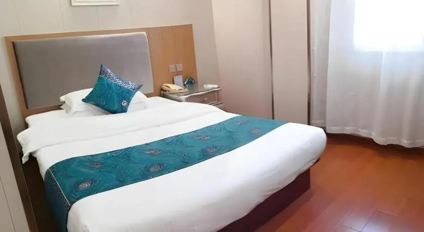 Bed in GreenTree Inn Wuxi Xinwu District Meicun Town Taibo Avenue