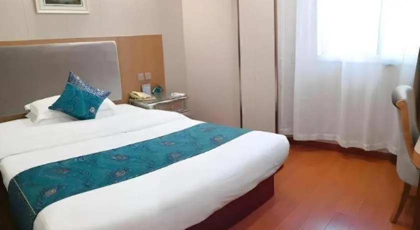 Bed in GreenTree Inn Wuxi Xinwu District Meicun Town Taibo Avenue