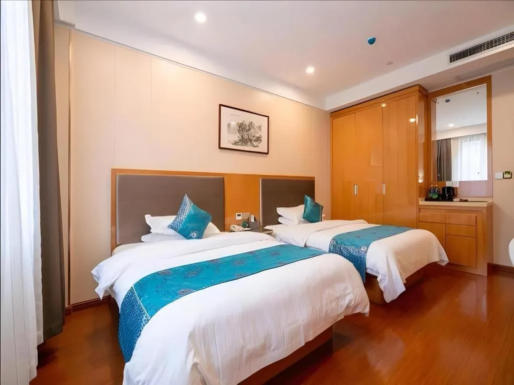 Bed in GreenTree Inn Wuxi Xinwu District Meicun Town Taibo Avenue