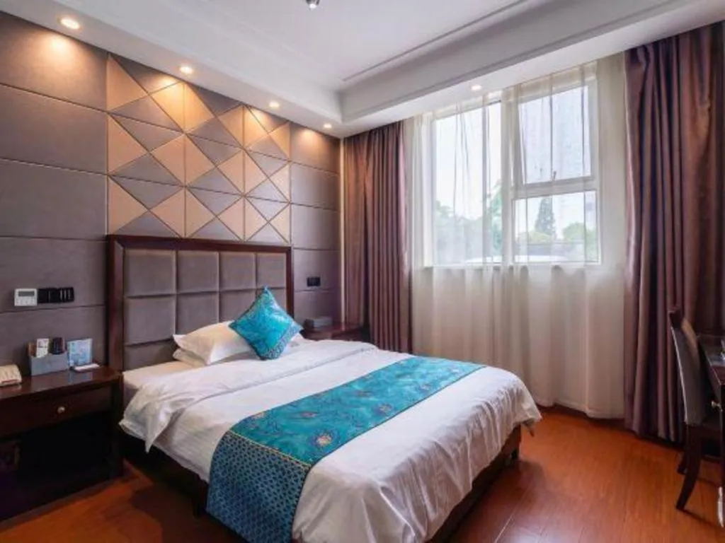 Bed in GreenTree Inn Wuxi Xinwu District Meicun Town Taibo Avenue
