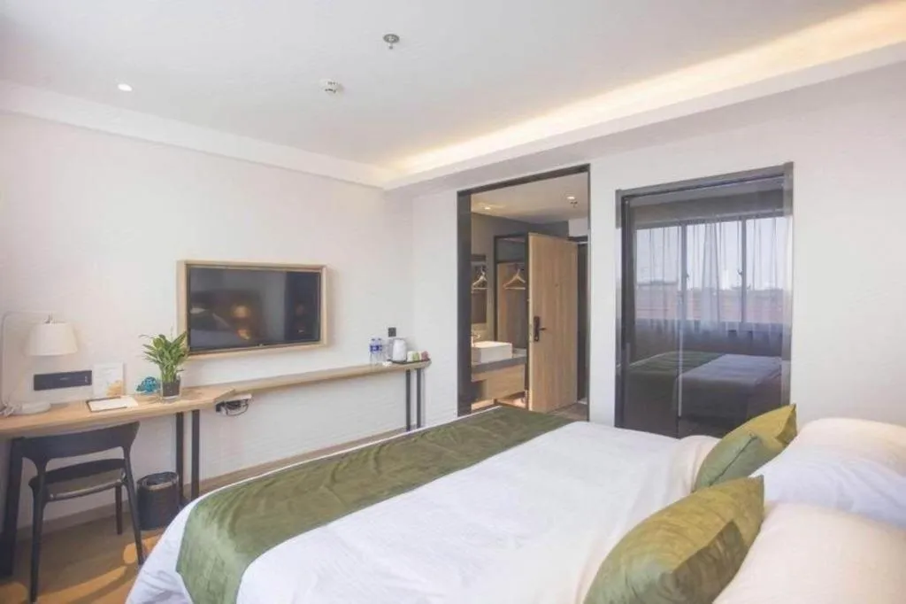 Bed in GreenTree Inn Express Taizhou Jiangyan Hardware City