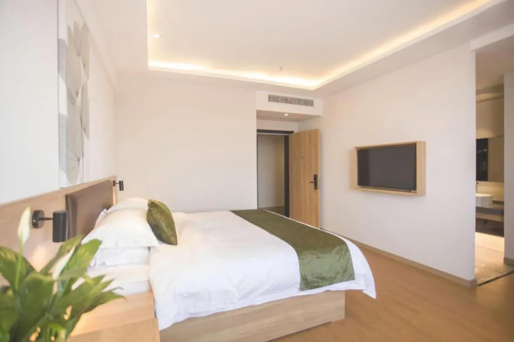 Bed in GreenTree Inn Express Taizhou Jiangyan Hardware City