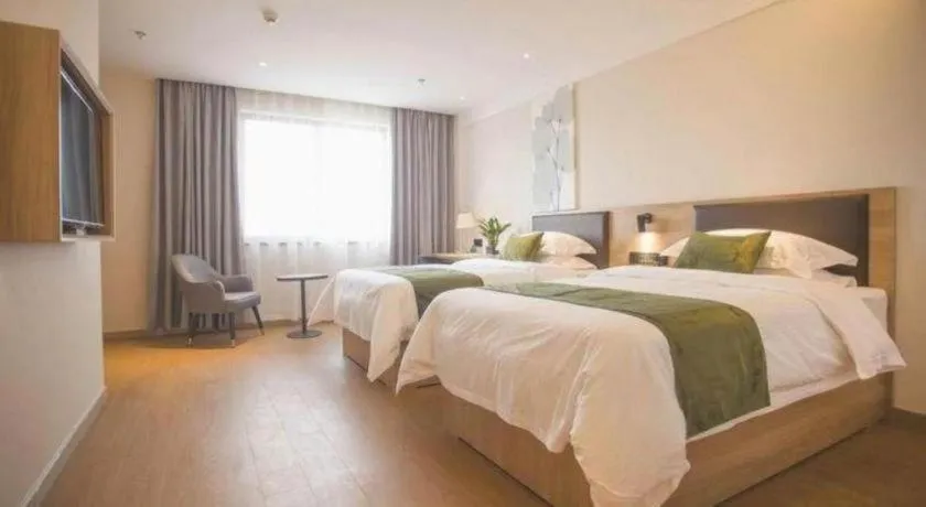 Bed in GreenTree Inn Express Taizhou Jiangyan Hardware City