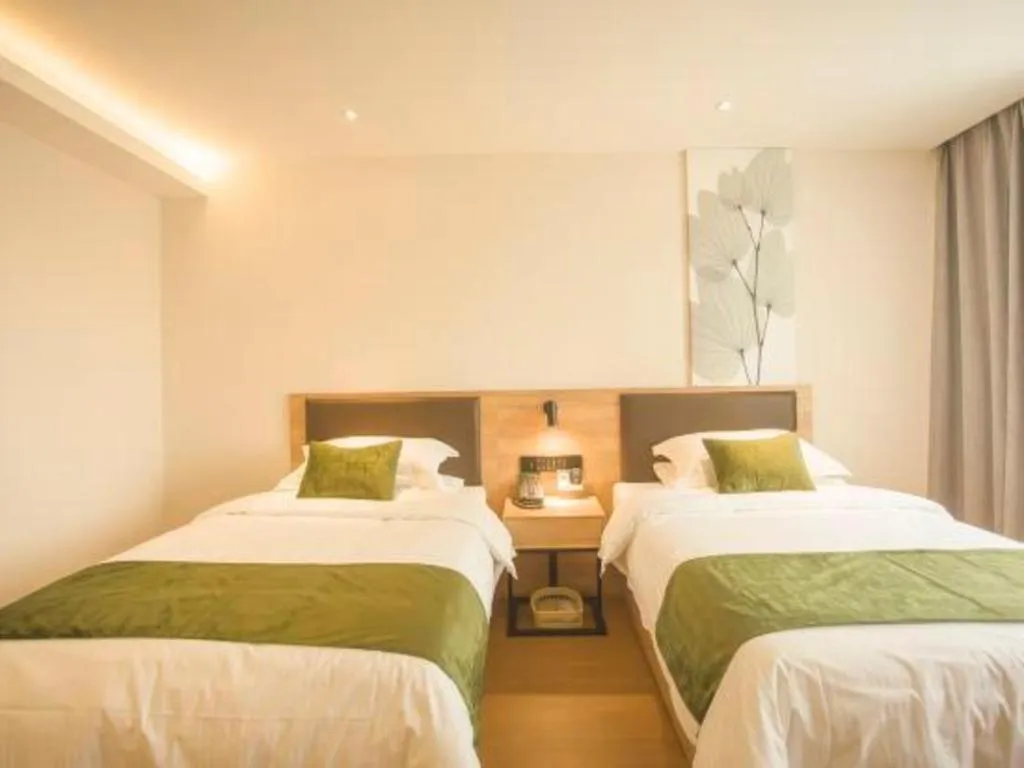 Bed in GreenTree Inn Express Taizhou Jiangyan Hardware City