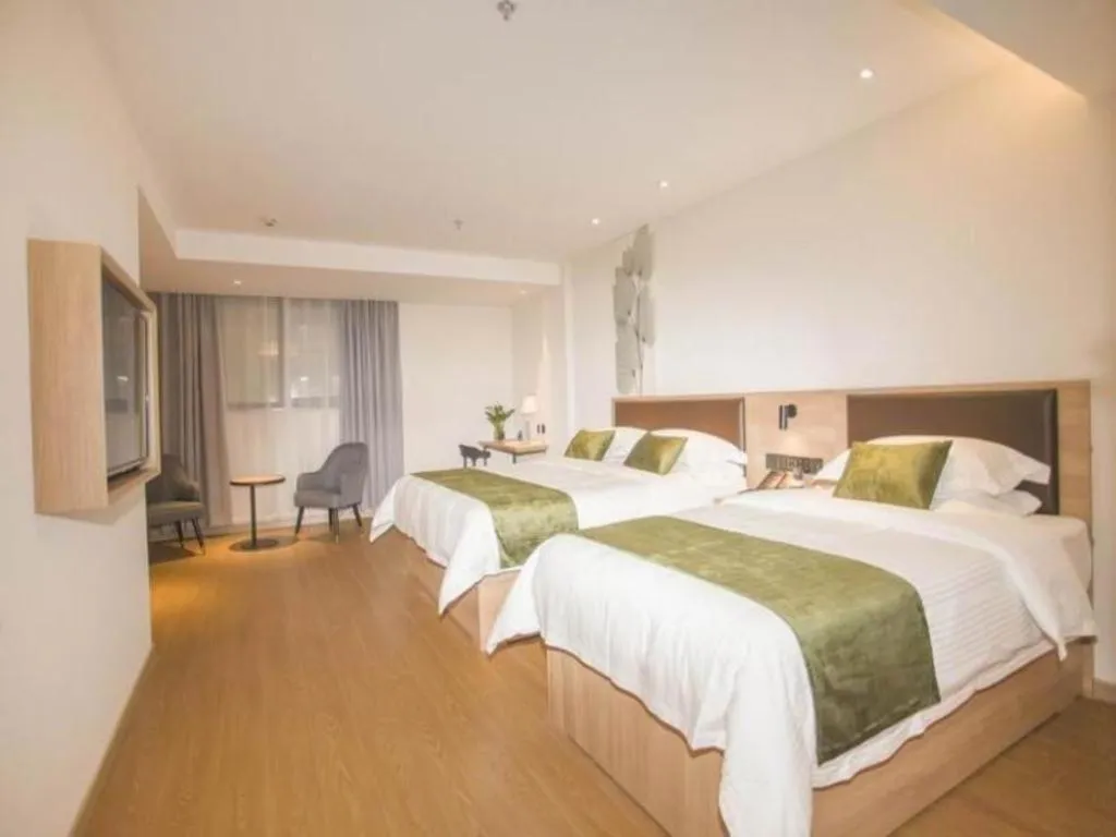 Bed in GreenTree Inn Express Taizhou Jiangyan Hardware City