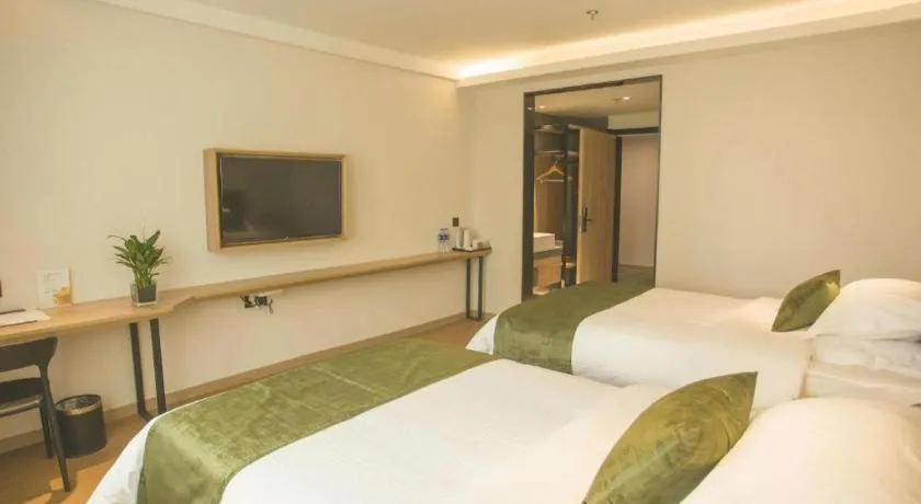 Bed in GreenTree Inn Express Taizhou Jiangyan Hardware City