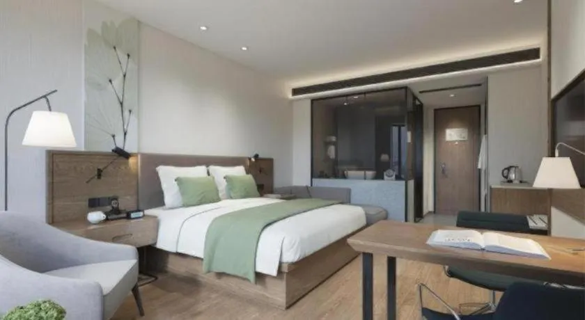 Bed in GreenTree Inn Express Taizhou Jiangyan Hardware City